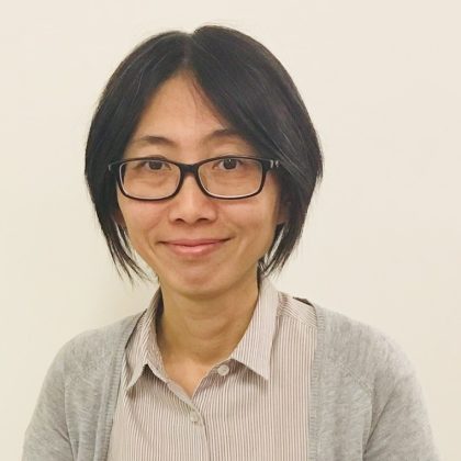 Dr Wen Ng smiles at the camera. She has short dark hair and is wearing glasses