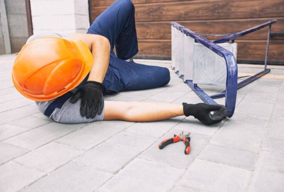construction worker laying on the floor after an accident